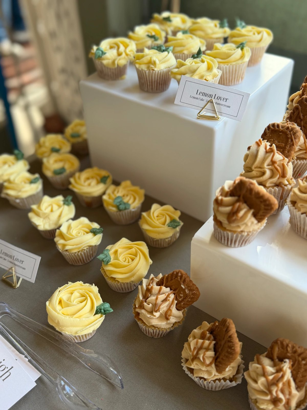 Lemon and cookie butter cupcakes on a dessert table
