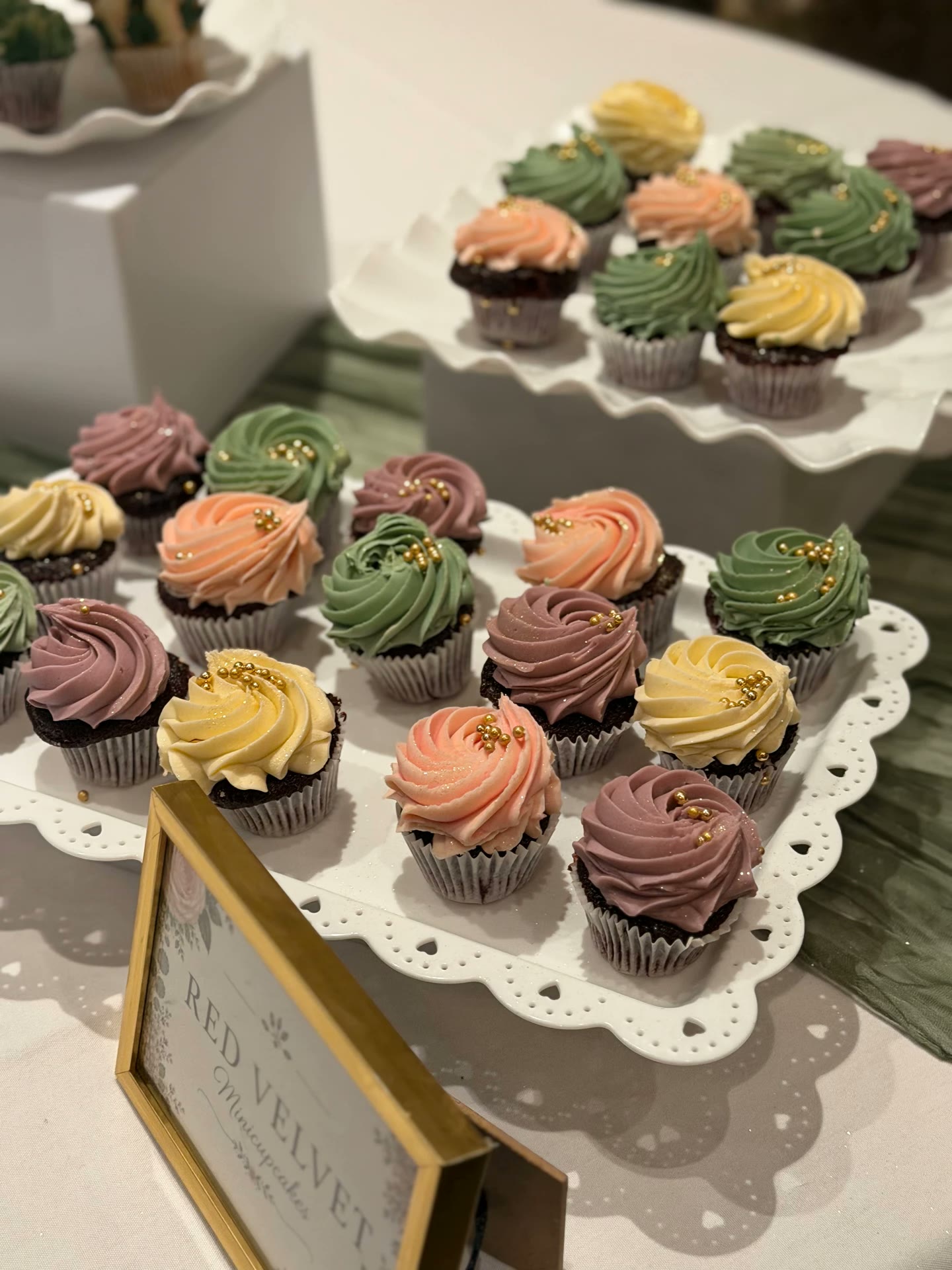 Colorful mini cupcakes displayed at an event