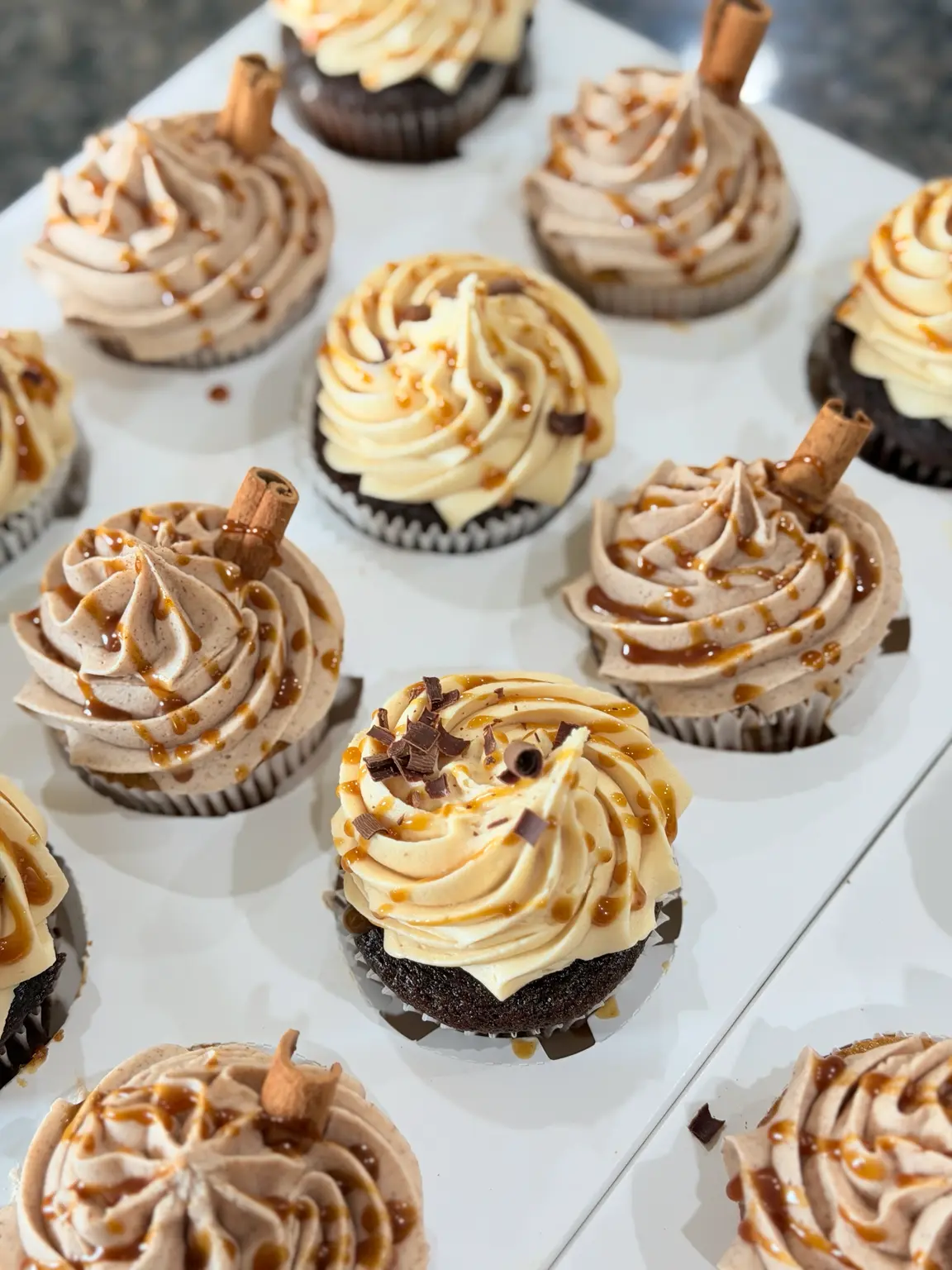 Caramel and cinnamon fall flavor cupcakes with caramel drizzle