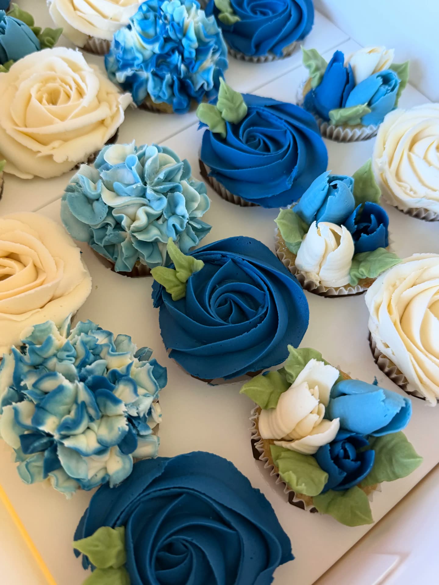 Blue and ivory buttercream floral cupcakes