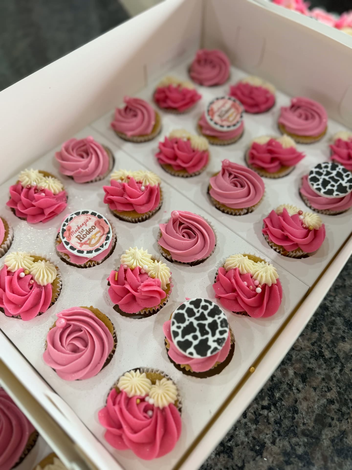 Pink rodeo-themed mini cupcakes with buttercream flowers